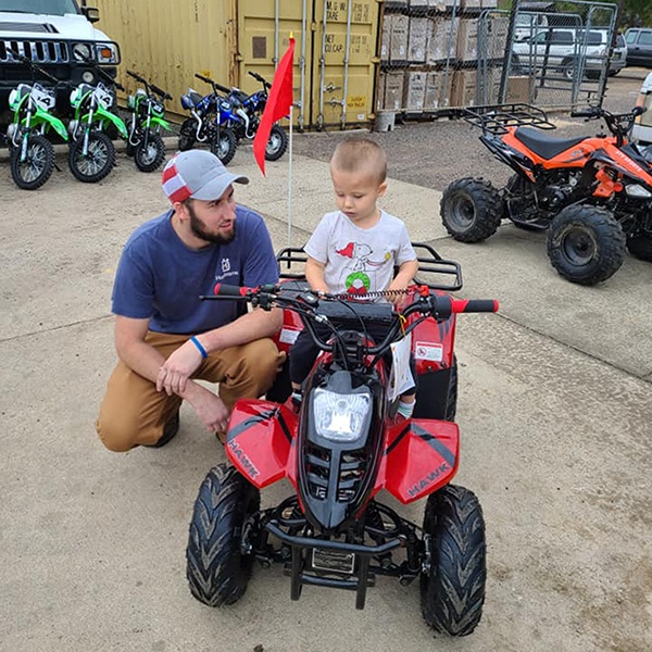 Maverick and his dad attended a special holiday event at Odenville Auto Parts & The Man Store & won a brand-new beginner ATV | 205.629.9111