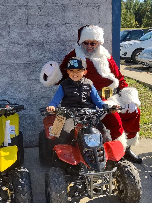 Maddox Aguire wins an AVT at the special holiday event at Odenville Auto Parts & The Man Store. He won a brand-new beginner ATV | 205.629.9111